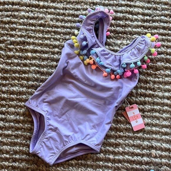 Anthropologie Other - Anthropologie PilyQ baby lavender purple rainbow pom pom ruffle one piece swim